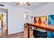 Bedroom/office featuring a large closet and wood flooring at 8116 N 55Th Dr, Glendale, AZ 85302