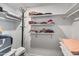Spacious walk-in closet with organized shelving and ample storage space at 8116 N 55Th Dr, Glendale, AZ 85302