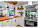 Modern kitchen with butcher block countertop, stainless steel appliances, and stylish lighting at 8116 N 55Th Dr, Glendale, AZ 85302