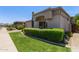View of the front exterior of the home showcasing the desert landscaping and a paver driveway at 8689 E Krail St, Scottsdale, AZ 85250