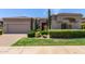 Charming single-story home with stucco exterior, desert landscaping and a paver driveway at 8689 E Krail St, Scottsdale, AZ 85250