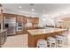 Kitchen with stainless steel appliances, granite countertops, and a breakfast bar at 8689 E Krail St, Scottsdale, AZ 85250