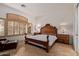 Bedroom with a decorative bed frame and shuttered windows at 8689 E Krail St, Scottsdale, AZ 85250