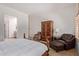 Bedroom featuring a cozy sitting area and access to the bathroom at 8689 E Krail St, Scottsdale, AZ 85250