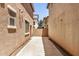 Backyard view showing concrete patio and block wall at 89 E Palomino Dr, Gilbert, AZ 85296