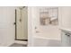 Bright bathroom with shower, soaking tub, and neutral walls at 89 E Palomino Dr, Gilbert, AZ 85296