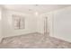 Bright bedroom featuring neutral walls, wood-look floors, and a modern chandelier at 89 E Palomino Dr, Gilbert, AZ 85296