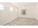 Spacious bedroom with ample natural light, neutral walls, wood-look floors and modern chandelier at 89 E Palomino Dr, Gilbert, AZ 85296