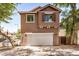 Inviting two-story home showcasing a 2-car garage and charming architectural details at 89 E Palomino Dr, Gilbert, AZ 85296