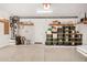 Spacious garage with shelving, storage containers and epoxy floor coating perfect for organization at 89 E Palomino Dr, Gilbert, AZ 85296