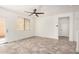 Spacious living room featuring modern flooring, an open floorplan, and an attached patio at 89 E Palomino Dr, Gilbert, AZ 85296