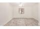 Spacious room with wood-look flooring, white walls, and a ceiling fan creates a comfortable space at 89 E Palomino Dr, Gilbert, AZ 85296
