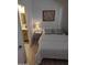 Comfortable bedroom adjacent to the bathroom with a bed, lamp, and tasteful decor, creating a relaxing atmosphere at 920 E Devonshire Ave # 2031, Phoenix, AZ 85014