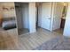Cozy bedroom features hardwood floors, a mirrored closet, and convenient access to an en-suite bathroom at 920 E Devonshire Ave # 2031, Phoenix, AZ 85014