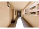 Well-maintained hallway with outdoor access to the community's residential units at 920 E Devonshire Ave # 2031, Phoenix, AZ 85014