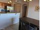 Spacious kitchen features stainless steel appliances, granite countertops, and a dining area with modern lighting at 920 E Devonshire Ave # 2031, Phoenix, AZ 85014