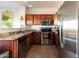 Charming kitchen featuring stainless steel appliances, tiled floors, and granite counters at 920 E Devonshire Ave # 2031, Phoenix, AZ 85014
