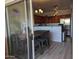 Kitchen featuring stainless appliances, barstool seating, and stylish lighting fixtures with a sliding door to a patio at 920 E Devonshire Ave # 2031, Phoenix, AZ 85014