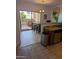 Bright kitchen view featuring an island with barstool seating and a stainless steel trash can at 920 E Devonshire Ave # 2031, Phoenix, AZ 85014