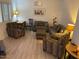 Inviting living room featuring neutral tones, comfortable seating, and light wood-look floors at 920 E Devonshire Ave # 2031, Phoenix, AZ 85014