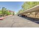 Community parking area with covered spots and views of the residential complex at 920 E Devonshire Ave # 2031, Phoenix, AZ 85014