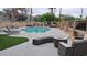 Community pool with lounge chairs, manicured landscaping, and an inviting atmosphere at 920 E Devonshire Ave # 2031, Phoenix, AZ 85014