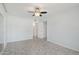 The room features tile flooring, a ceiling fan, and an entrance to another room at 9802 N Balboa Dr, Sun City, AZ 85351