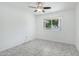 The room offers tile flooring, a ceiling fan, and a window at 9802 N Balboa Dr, Sun City, AZ 85351
