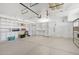 Spacious garage with built-in shelving and workshop area at 9802 N Balboa Dr, Sun City, AZ 85351