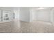 Spacious living room with light tile flooring, offering a versatile space for relaxation and entertaining at 9802 N Balboa Dr, Sun City, AZ 85351