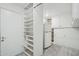 Room with refrigerator and extensive shelving at 9802 N Balboa Dr, Sun City, AZ 85351