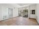 A sun room with tile flooring and access to the interior of the house and a sliding door to the exterior at 9802 N Balboa Dr, Sun City, AZ 85351