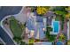 Aerial view of a desert home with a backyard pool, pergola, desert landscape at 9921 E Doubletree Ranch Rd, Scottsdale, AZ 85258