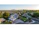 Real estate featuring lush greenery, a circular driveway, mountain views, and mature palm trees at 9921 E Doubletree Ranch Rd, Scottsdale, AZ 85258