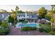 A lavish backyard featuring a pool, pergola, lush landscaping, and mature trees at 9921 E Doubletree Ranch Rd, Scottsdale, AZ 85258