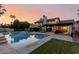 Expansive backyard with pool, patio, and manicured lawn, ideal for outdoor entertaining at 9921 E Doubletree Ranch Rd, Scottsdale, AZ 85258