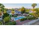 A lavish backyard featuring a pool, pergola, lush landscaping, and mountain views at 9921 E Doubletree Ranch Rd, Scottsdale, AZ 85258