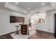 Basement wet bar featuring a custom table made from a wine barrel and tractor-seat bar stools at 9921 E Doubletree Ranch Rd, Scottsdale, AZ 85258