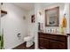 Powder room featuring white toilet, custom vanity and mirror, and wood-look flooring at 9921 E Doubletree Ranch Rd, Scottsdale, AZ 85258