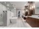 Bright primary bathroom featuring a walk-in shower, soaking tub, and dual sink vanity at 9921 E Doubletree Ranch Rd, Scottsdale, AZ 85258