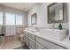 Bathroom featuring dual sinks with modern fixtures and tile floors at 9921 E Doubletree Ranch Rd, Scottsdale, AZ 85258