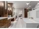 Bright bathroom featuring a modern tub, spacious vanity, and elegant fixtures at 9921 E Doubletree Ranch Rd, Scottsdale, AZ 85258