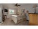 Cozy bedroom with a ceiling fan, plantation shutters, and ensuite bathroom at 9921 E Doubletree Ranch Rd, Scottsdale, AZ 85258