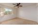 Comfortable bedroom featuring a ceiling fan, closet, and bright window at 9921 E Doubletree Ranch Rd, Scottsdale, AZ 85258