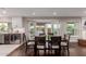 Formal dining room with dark wood table, french doors to pool and a beverage cooler at 9921 E Doubletree Ranch Rd, Scottsdale, AZ 85258
