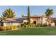 Charming home showcasing a lush lawn, mature trees, and inviting curb appeal at 9921 E Doubletree Ranch Rd, Scottsdale, AZ 85258