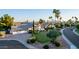 Beautifully landscaped home with desert landscape and a long circular driveway at 9921 E Doubletree Ranch Rd, Scottsdale, AZ 85258