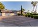 Well-maintained home boasting a spacious driveway, three-car garage, and mature trees at 9921 E Doubletree Ranch Rd, Scottsdale, AZ 85258
