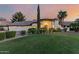 Stunning single-story home with lush lawn, manicured landscaping, and grand entrance with decorative columns at 9921 E Doubletree Ranch Rd, Scottsdale, AZ 85258
