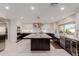 Bright, open kitchen with stainless steel appliances, granite countertops and a large kitchen island at 9921 E Doubletree Ranch Rd, Scottsdale, AZ 85258